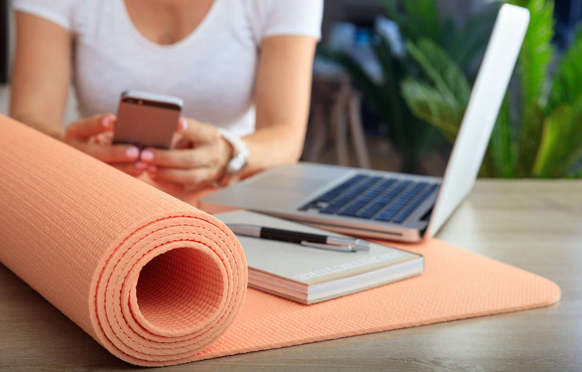 Woman and an exercise mat in an office background